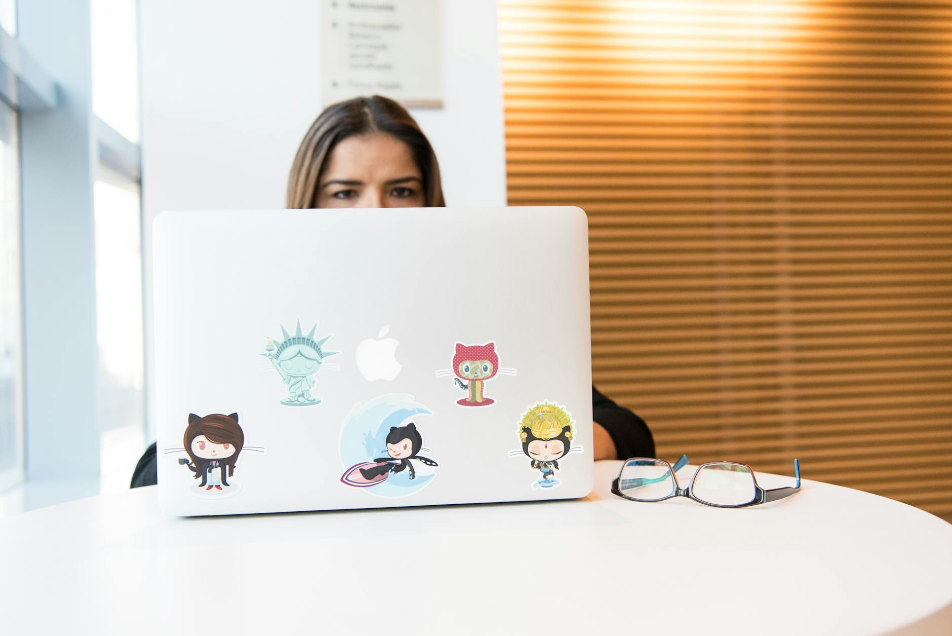 woman sitting in front of laptop